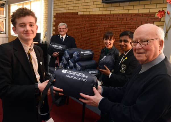 St Aidan's Catholic Academy students present sleeping bags to Churches Together for the homeless.