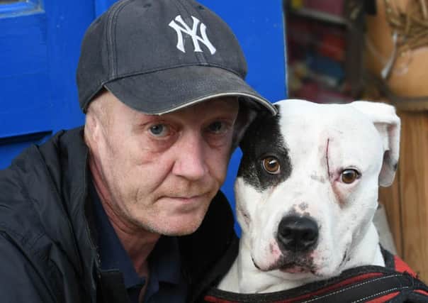 Gary Nichols with his dog Narni, which was stabbed.