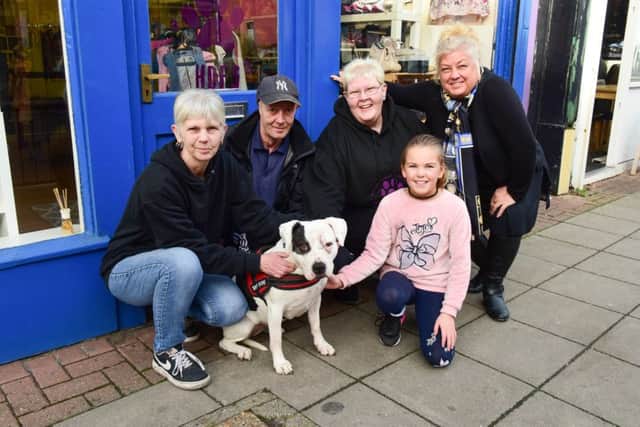 Gary Nichols with his dog Narni pictured outside the Happier days for Strays shop in Hylton Road, Sunderland, with from left Wendy Williams and Dawn Harrison of Happier Days for Strays, Michelle Imeson of Goodfillers cafe, Hylton Road with her grand daughter Natalia Elston (8)