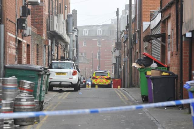 Police have cordoned off the scene of the murder in a back lane behind Derwent Street and Holmeside, in Sunderland city centre.