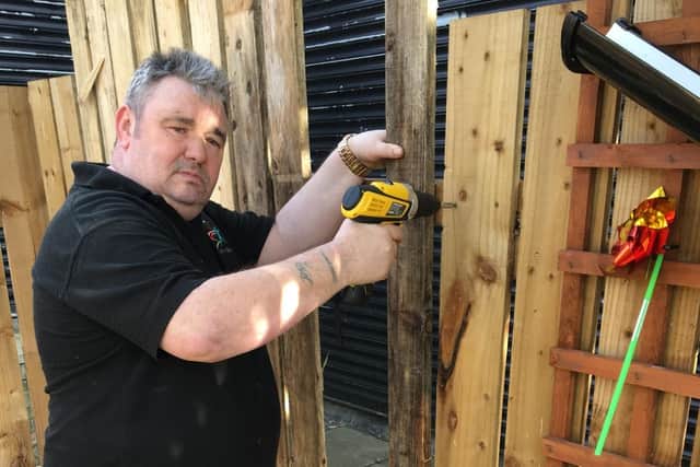 John Jevon carries out repairs at the sensory garden run by Include 'In' Autism at the Downhill Centre, Sunderland.