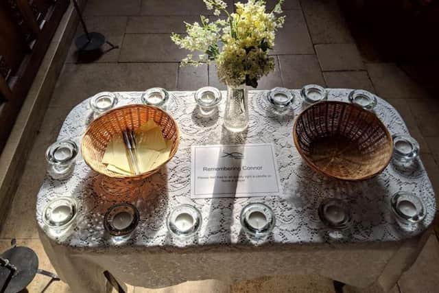 The table set up in the Bede Chapel of Sunderland Minister, offering people a chance to write a prayer following the death of Connor Brown or light a candle in his name.