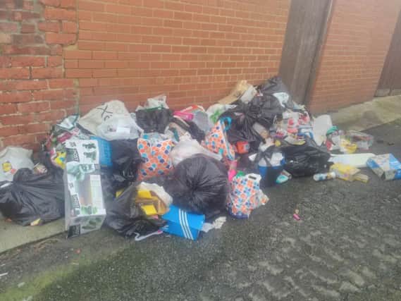The rubbish that was flytipped in a back lane