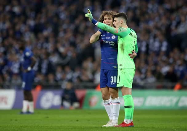 Chelsea goalkeeper Kepa Arrizabalaga (right) refuses to leave the pitch after his proposed substitution during the Carabao Cup Final.