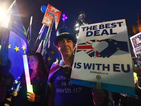 Anti-Brexit demonstrators protesting outside the Houses of Parliament tonight. Photo: Victoria Jones/PA Wire.