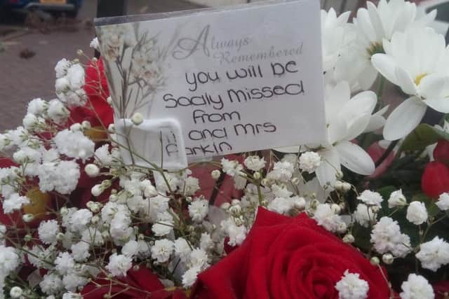 Tributes left outside the GP surgery