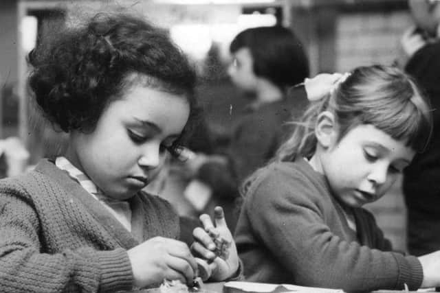Memory Lane social flow   February 1959  

Concentrating hard.  Yasmin Ali and Judith Cartman at Laygate Infants School.