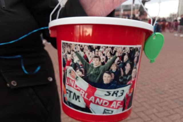 Buckets were decorated with a photo of Connor Brown and his friends as supported collected funds outside the Stadium of Light to donate to his family.