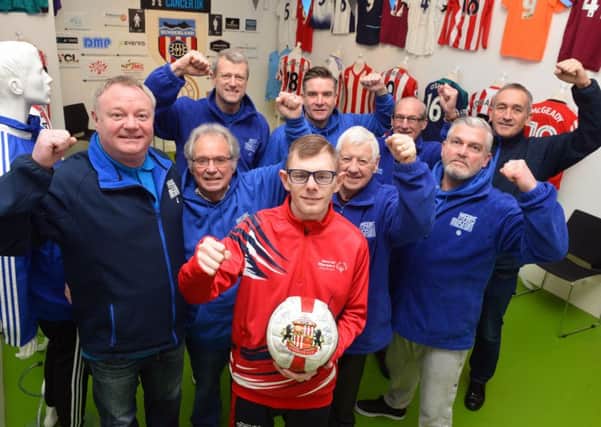 GB Special Olympic footballer Liam Lister visits Fans Museum were he's an ambassador ahead of the games in Abu Dhabi. Museum founder Michael Ganley (L) with volunteer team