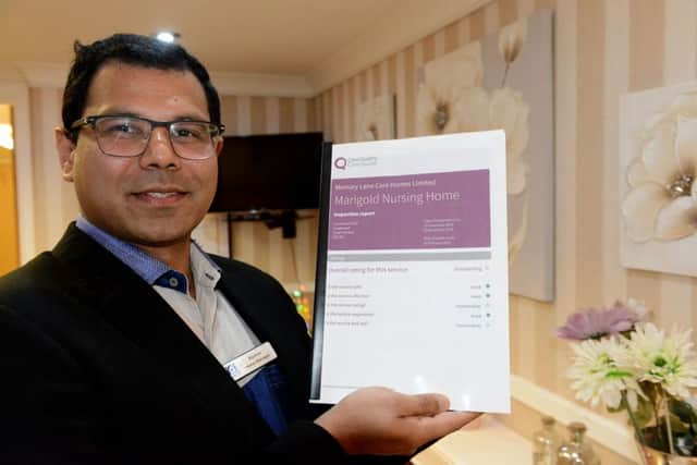 Bijumon Joseph owner and manager of Marigold Nursing Home with their Outstanding Certificate. Picture by FRANK REID