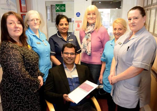 Bijumon Joseph manager of Marigold Nursing Home with their Outstanding Certificate and staff members (left to right) Joanne Fielden, Lynn Davison, Noby Biju, Yvonne Ivey, Doreen Hardy and Diane Mason. Picture by FRANK REID