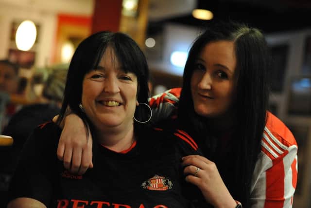 Sunderland fans Christine Savage and daughter Claire Moore celebrate the teams Checkatrade Trophy semi final win at Quinn's Bar, Stadium of Light, Sunderland.
