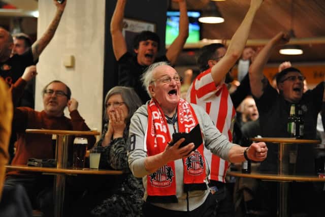 Sunderland fan George Simpson celebrates the teams Checkatrade Trophy semi final win at Quinn's Bar, Stadium of Light, Sunderland.