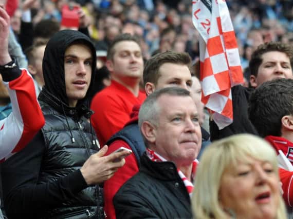 Jordan Henderson in the stands for Sunderland's Capital One Cup Final against Manchester City at Wembley Stadium