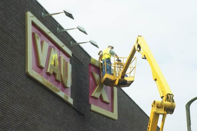 Vaux signs being taken down from the city centre site on  Wednesday July 7 1999