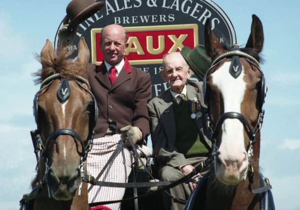 First World War veteran Bill Rennoldson (96) was treated to a ride with the Vaux horses on July 13, 1993. He's pictured with dray driver Robert Macklin riding through the city streets