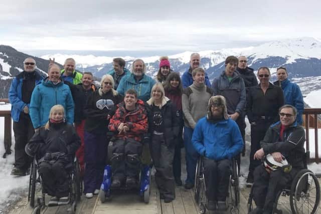 Donna Binyon, centre front, on a ski trip last year with Snow Buddies.