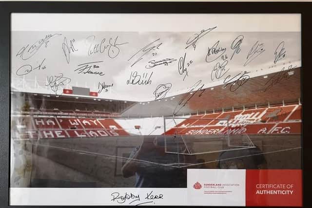 A signed photo of The Stadium of Light.