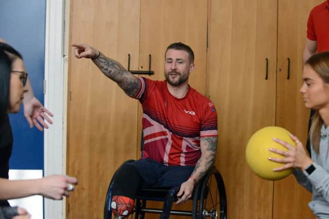 Invictus Games gold medal winner Stuart Robinson even puts the staff at St Patrick's RC Primary School through their paces.