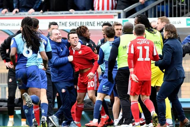 A game of high tension exploded in stoppage time as three red cards were handed out