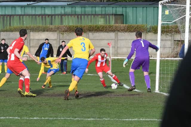 Ryhope CW (red/white) v Stockton Town (yellow) at Ryhope CW on Saturday.