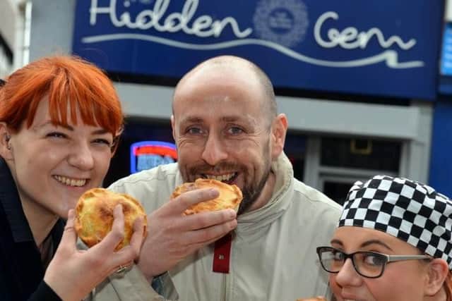 Hidden Gem Cafe's Francesca Aggio, owner Craig Lynch and chef Naomi Goldsmith try the cheesy chip pies
