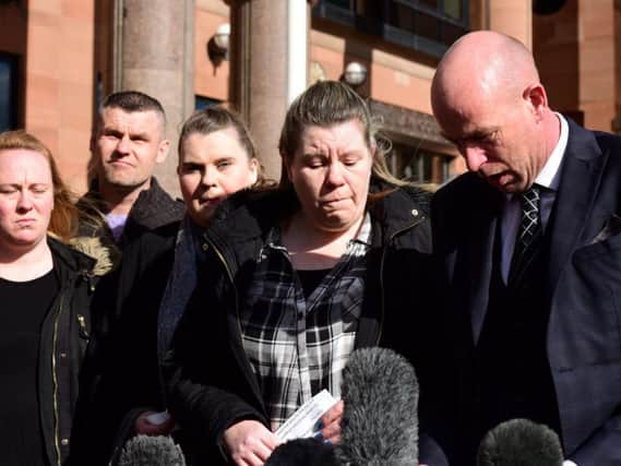 Joan Hoggett's daughter, Michelle Young, and Joan's son, Robert Young (right) are joined by other family members at Newcastle Crown Court.