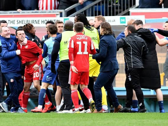 Sunderland captain George Honeyman was sent off following the touchline melee at Adams Park