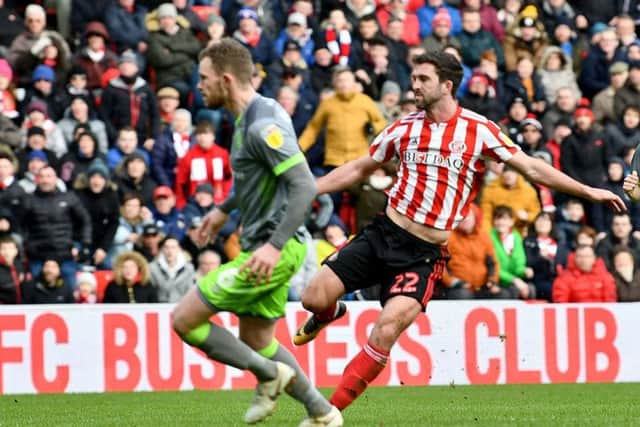 Will Grigg scores the winning goal in Sunderland's 2-1 win over Walsall at the Stadium of Light.