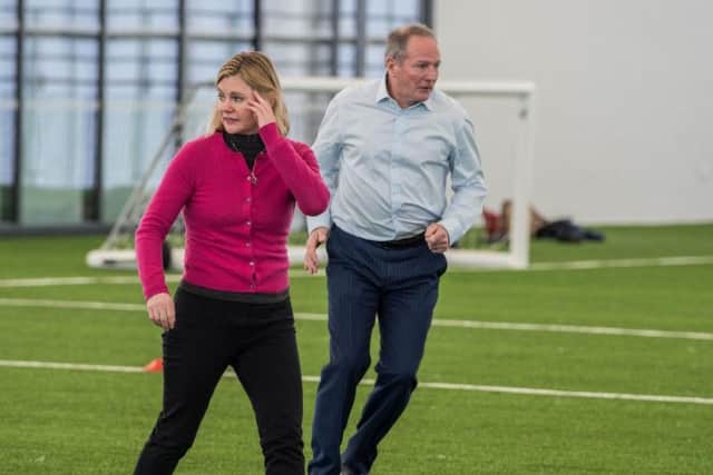 Former Education Minister Justine Greening MP and David Harrison on the pitch at the Beacon of Light.