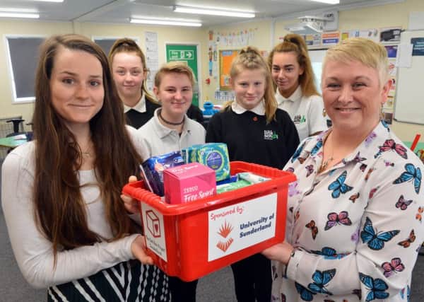 Katy Sawyer donates supplies to The Link School. Gina Nesbitt (R). Pupils from left Millie Hodgson, Summer Lyndsey, Abbey Smythe and Alisha Webster.