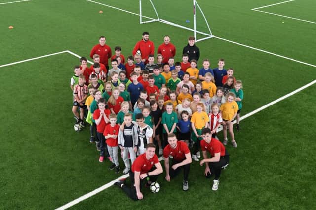 SAFC u23 footballers Jack Connolly, Alex Storey and Jacob Young with pupils at the Beacon of Light with pupils from West Rainton Primary School.