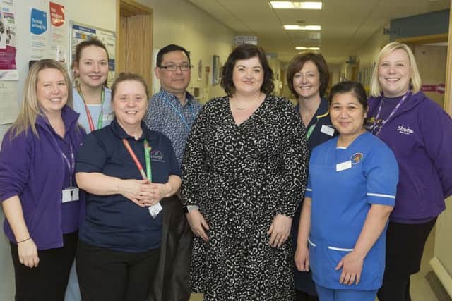 Claire Challoner with some of the members of the Acute Stroke Unit team who helped to save her life.