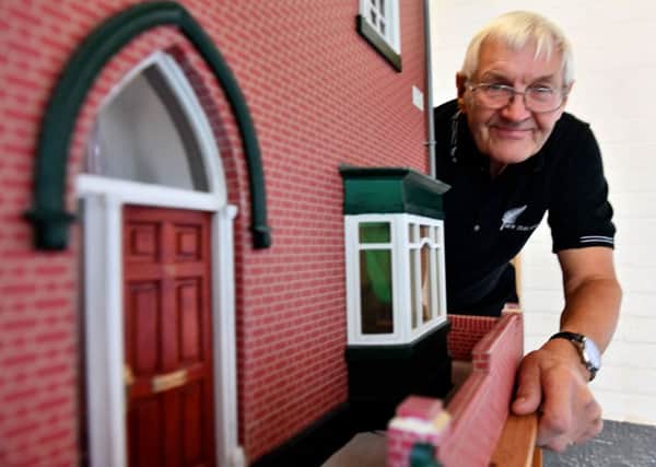 Wally Nanson next to the model house he made as replica of his former Roker Avenue home.
