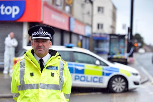 Superintendent Paul Milner, of Northumbria Police, outside the One Stop shop as inquiries into Joan Hogget's death were carried out last September.