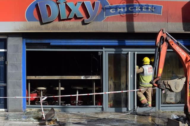 An investigation into the cause of the fire at Dixy Chicken continues today