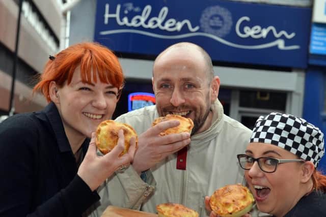Hidden Gem Cafe's Francesca Aggio, owner Craig Lynch and chef Naomi Goldsmith try the cheesy chip pies.