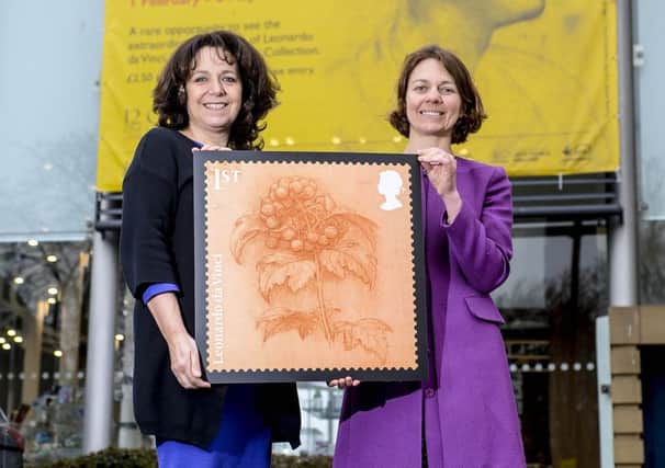Rebecca Ball, Creative Director of Sunderland Culture and (R) Julie Elliott MP for Sunderland Central hold an enlarged print of the Leonardo Da Vinci postal stamp which is being exhibited at Sunderland Museum and Winter Gardens