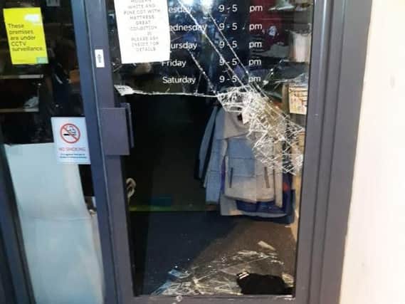 The damage caused to the charity shop