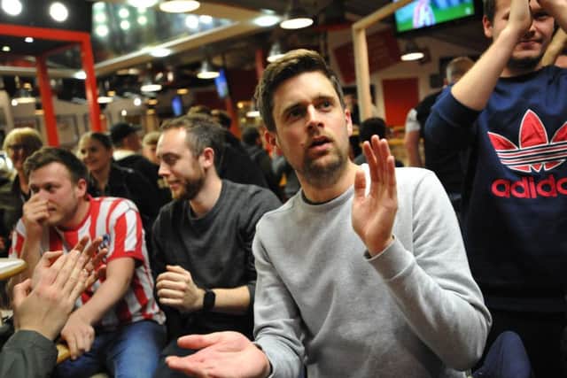 Sunderland fans celebrate the teams Checkatrade Trophy semi final win in Quinn's Bar at the Stadium of Light