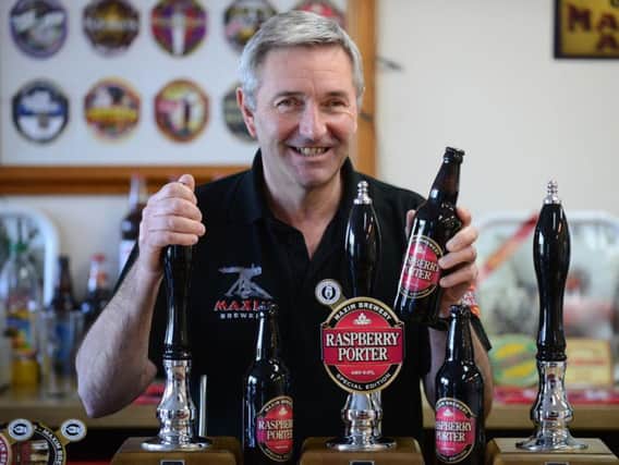 Maxim Brewery managing director Mark Anderson with new bottles of Raspberry Porter.