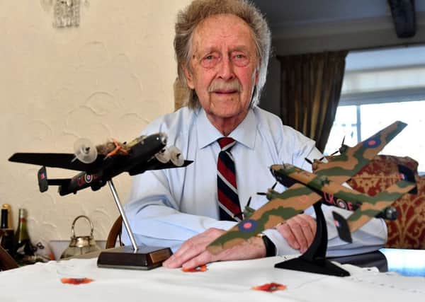 Alan Mitcheson with models of the Halifax bomber.