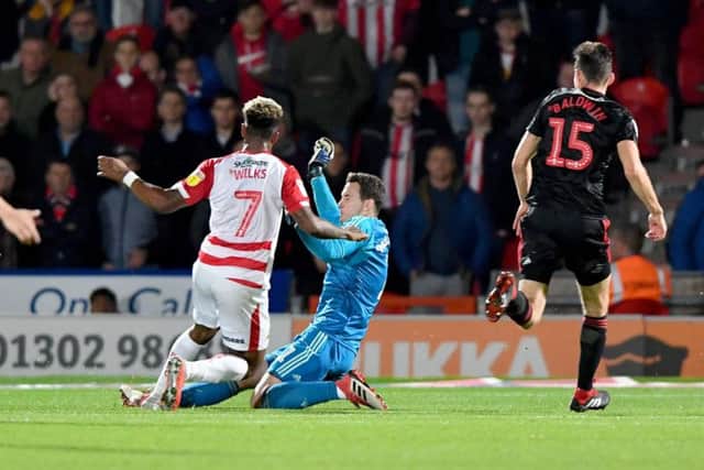 Jon McLaughlin makes a crucial save against Doncaster Rovers earlier in the season