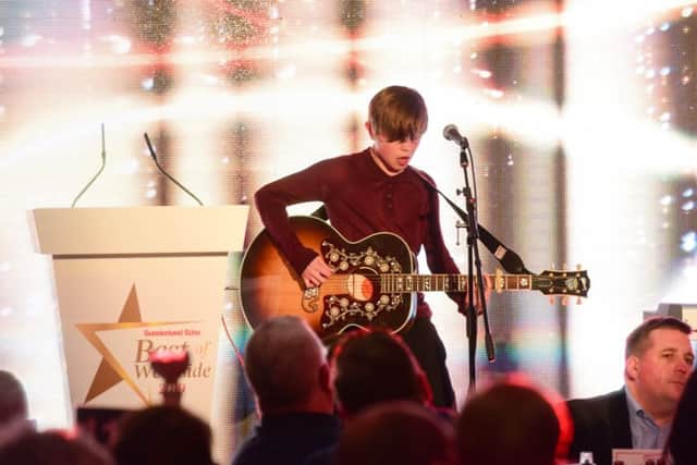 Singer/songwriter Tom Mouse Smith performing at the awards.