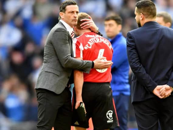 Jack Ross consoles Lee Cattermole at the final whistle.