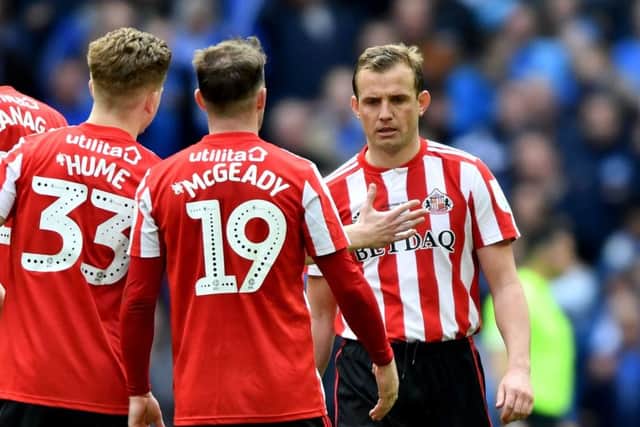 Lee Cattermole is consoled by teammates after his penalty miss