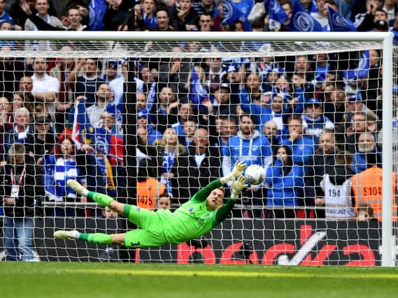 Craig MacGillivray makes the crucial penalty save in the Checkatrade Trophy final