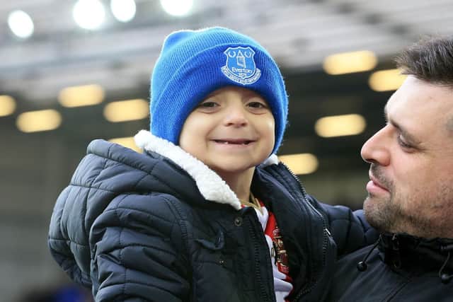 Bradley Lowery in the arms of his dad Carl ahead of a game at Goodison Park. Photo by PA.