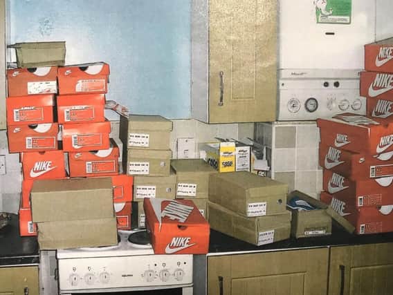 Boxes of counterfeit Nike trainers found at Kelly Trott's home.