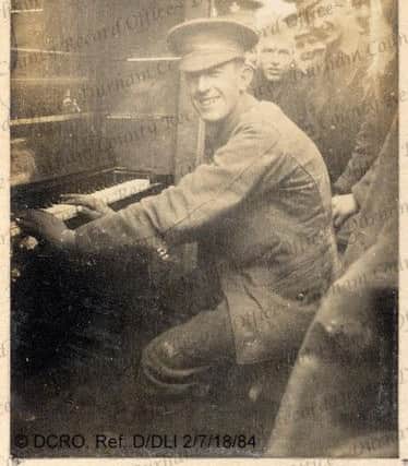 Trench pianist Barney McArdle, of the 7th Battalion DLI, France, 1915. D/DLI 2/7/18/84. Photo; Durham County Record Office.